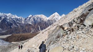 trekkers trekking on the way to dharapani through rugged landscpes 