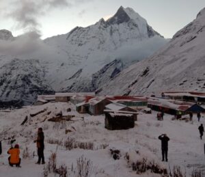 Trekkers descending on snowy trail