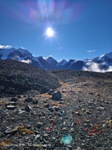 Rocky Mountain terrain under a bright sun.