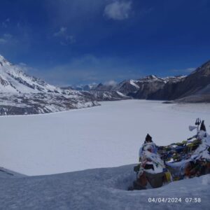 Frozen Tlicho Lake surrounded by mountains 