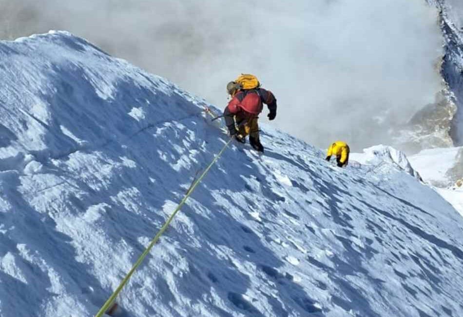 Climber ascending trail during Ama Dablam