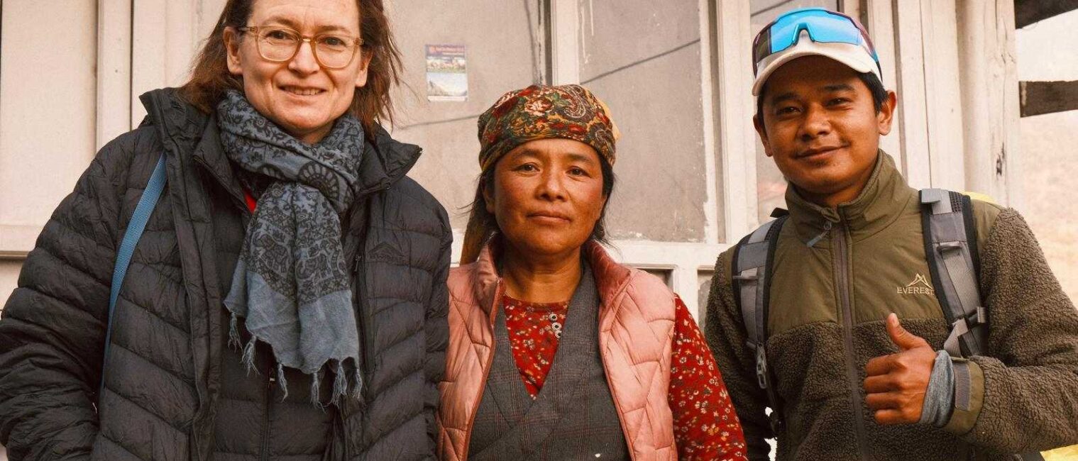 A local woman with tourist and Guide during Tamang Heritage Gosaikunda Trek